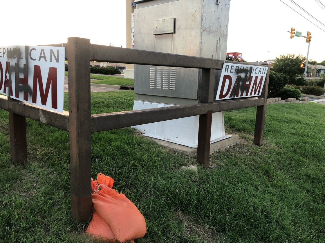 Dahm's signs have been vandalized with symbols of hate.
